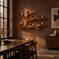 Tree root wine bottle holder with gnarled branching arms in an industrial loft dining room with exposed brick