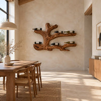 Tree root wine bottle holder with gnarled branching arms in a bright open plan dining room