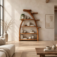 Tree shaped bookshelf with an arched branch frame and four open shelves in a bright open plan living room
