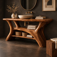 Corner detail of bathroom vanity with forked trunk shaped legs and a low open shelf beside wood, brass and linen samples