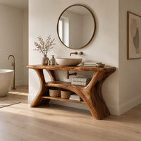 Bathroom vanity with forked trunk shaped legs and a low open shelf in a Scandinavian bathroom with white walls