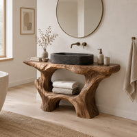 Tree trunk bathroom vanity with a natural edge top and open arched base in a Scandinavian bathroom with white walls