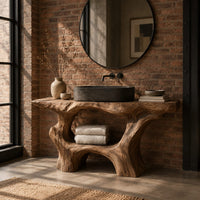 Tree trunk bathroom vanity with a natural edge top and open arched base in an industrial loft bathroom with exposed brick