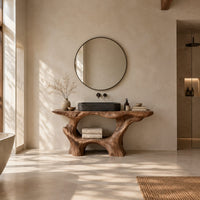 Tree trunk bathroom vanity with a natural edge top and open arched base in a bright open plan bathroom