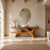 Tree trunk bathroom vanity with a slab top and an open lower shelf in a bright open plan bathroom