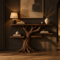 Console table shaped like a tree with root feet and staggered shelves in a dark entryway at golden hour