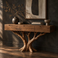 Console table with three drawers on a carved tree trunk base, three-quarter view showing the grain