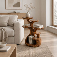 Tree shaped end table with scalloped tiers and a curled base nook in a Scandinavian living room with white walls