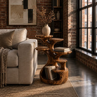 Tree shaped end table with scalloped tiers and a curled base nook in an industrial loft living room with exposed brick