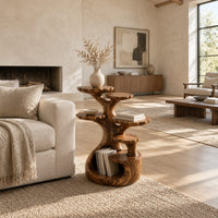 Tree shaped end table with scalloped tiers and a curled base nook in a bright open plan living room
