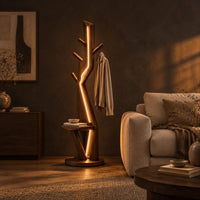 Tree shaped floor lamp with a glowing seam, short pegs and a tray in a dark living room at golden hour