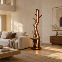 Tree shaped floor lamp with a glowing seam, short pegs and a tray in a bright open plan living room