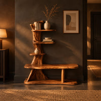 Tree trunk shoe bench with stepped shelves and an open lower base in a dark entryway at golden hour