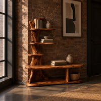 Tree trunk shoe bench with stepped shelves and an open lower base in an industrial loft entryway with exposed brick