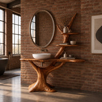 Tree trunk vanity with a root base, a slab top and two branch shelves in an industrial loft bathroom with exposed brick