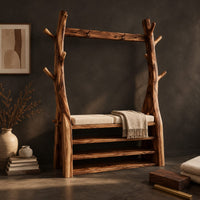 Corner detail of tree trunk wardrobe with a top beam and bench seat above open shelves beside wood, brass and linen samples