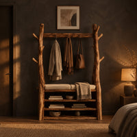 Tree trunk wardrobe with a top beam and bench seat above open shelves in a dark bedroom at golden hour
