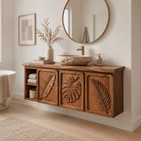 Bathroom vanity cabinet with three tropical leaf carved doors and an open shelf in a Scandinavian bathroom with white walls