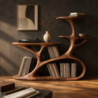 Corner detail of branching tree form turntable stand with tiered shelves and oval cutouts beside wood, brass and linen samples