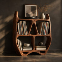 Turntable stand shaped like a sculpted open shelf unit with two pointed tips, three-quarter view showing the grain
