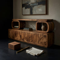 Corner detail of TV cabinet with stacked loop shelves above beside wood, brass and linen samples