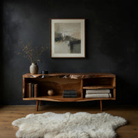 Mid century TV console with a live edge top in a dark studio against a charcoal wall