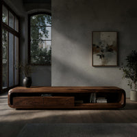 Low capsule TV console with a drawer box and open end in a concrete and timber loft