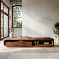 Low capsule TV console with a drawer box and open end in an open plan space in daylight