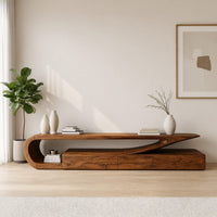 TV console with a curling hook top over drawers in a bright modern living room