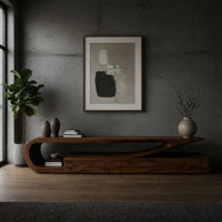 TV console with a curling hook top over drawers in a concrete and timber loft
