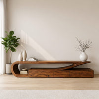 TV console with a curling hook top over drawers in an open plan space in daylight