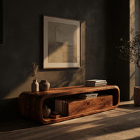 TV console with a loop frame around a drawer box in a living room at golden hour