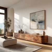 Low TV stand with wave carved door fronts in a bright modern living room