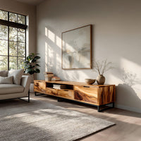 TV stand with figured wood doors on a black metal frame in a bright modern living room
