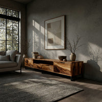 TV stand with figured wood doors on a black metal frame in a concrete and timber loft