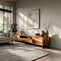 TV stand with figured wood doors on a black metal frame in an open plan space in daylight