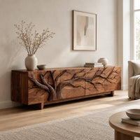 Tv stand with a carved branching tree across four front panels on tapered feet in a Scandinavian living room with white walls