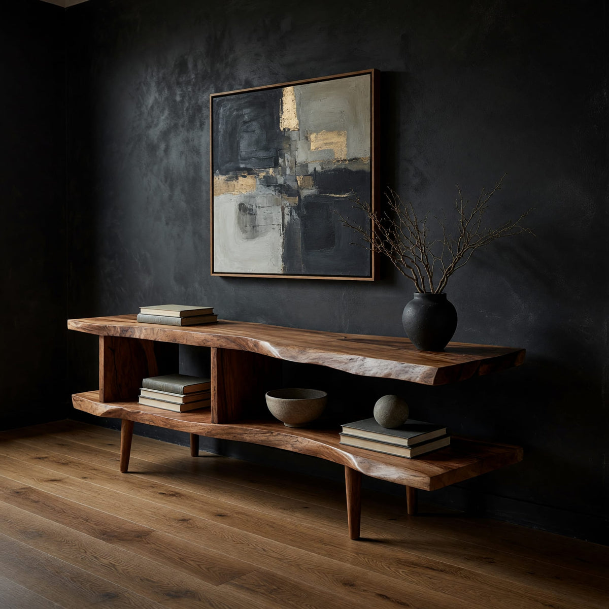 Split level live edge TV stand on tapered legs in a dark studio against a charcoal wall