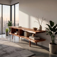 Split level live edge TV stand on tapered legs in a sunlit room with large windows and plants