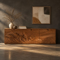 Corner detail of low wooden tv stand with carved ocean wave and sun ray doors beside wood, brass and linen samples