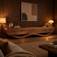 Low tv stand with a thick four panel body on a wavy ribbon base in an evening living room with walnut wall paneling