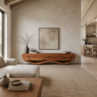 Low tv stand with a thick four panel body on a wavy ribbon base in a bright open plan living room