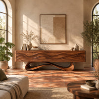 Tv stand with four wave carved panels on a looping pedestal base in a bright living room with arched windows and plants