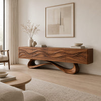 Tv stand with four wave carved panels on a looping pedestal base in a Scandinavian living room with white walls