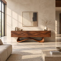 Tv stand with four wave carved panels on a looping pedestal base in a bright open plan living room