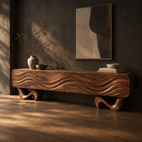 Tv stand with four wave carved panels on two twisting ribbon feet, three-quarter view showing the grain