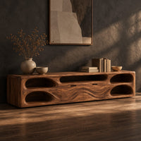 Long tv stand with pill shaped end niches and two center fronts, three-quarter view showing the grain