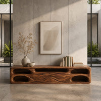 Corner detail of long tv stand with pill shaped end niches and two center fronts beside wood, brass and linen samples