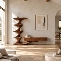 Tv stand with a tiered sculpted tower and a long low cabinet in a bright open plan living room