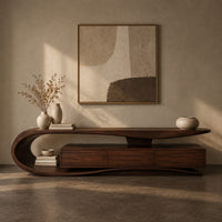 Corner detail of tv stand with a sweeping loop end and low three panel cabinet beside wood, brass and linen samples